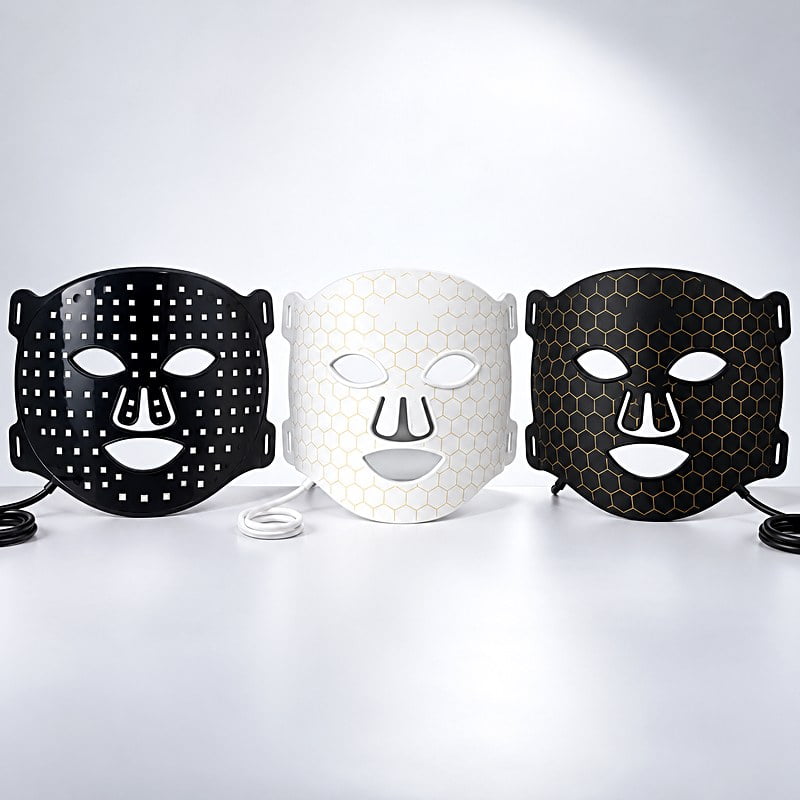 Three LED face mask shells in black and white finishes ready for custom logo branding